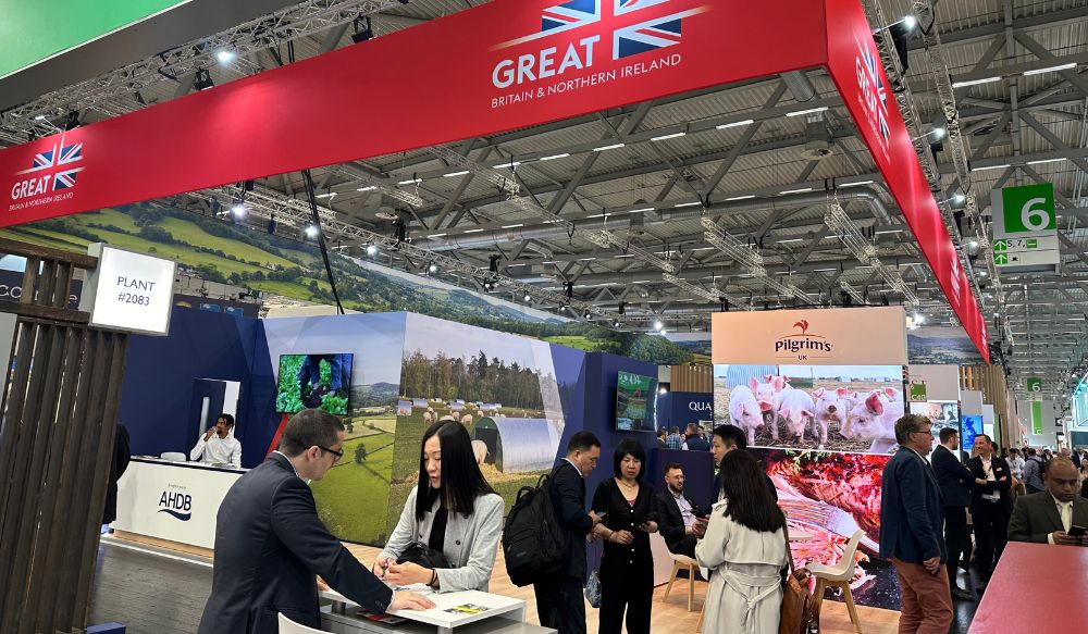 People standing on AHDB's stand at the Anuga exhibition in Germany, October 2023